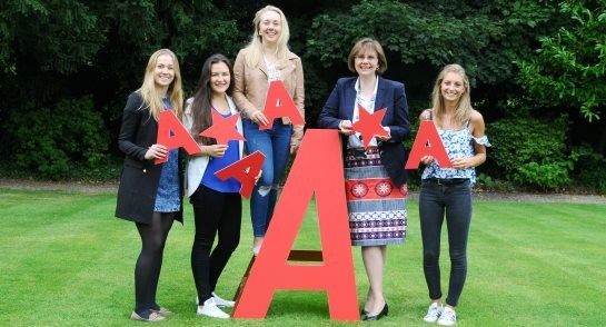 Principal, Sylvia Brett, celebrates an impressive set of A level results with Sixth Form students
