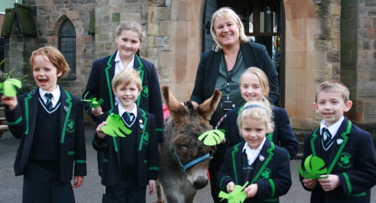 Highfield pupils join School Chaplain, Jo Wright and Nellie the donkey for the annual Palm Parade