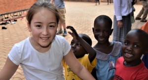 Highfield Pupil with Bombo school children