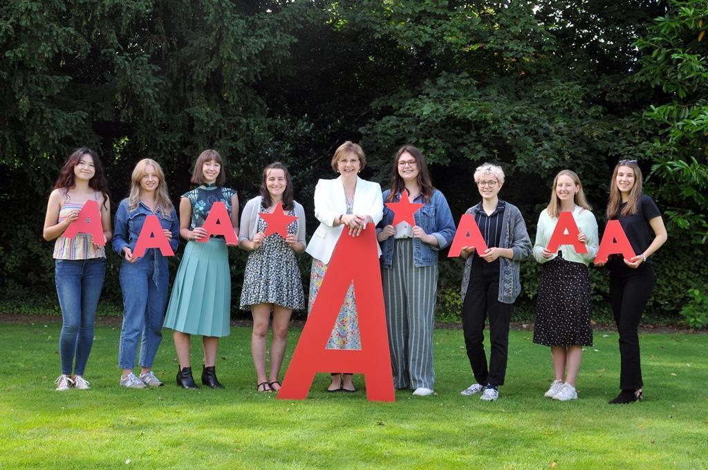 Sylvia Brett, Principal of Harrogate Ladies’ College and pupils celebrate achieving impressive A levels