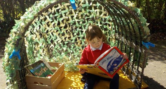 Pre-school in the garden learning about plants