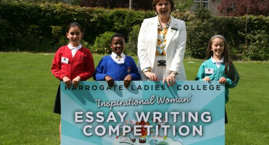 Harrogate Ladies' College Principal, Sylvia Brett celebrates with the Year 3, 4 and 5 winners of the Inspirational Woman Essay Writing Competition on the school lawn