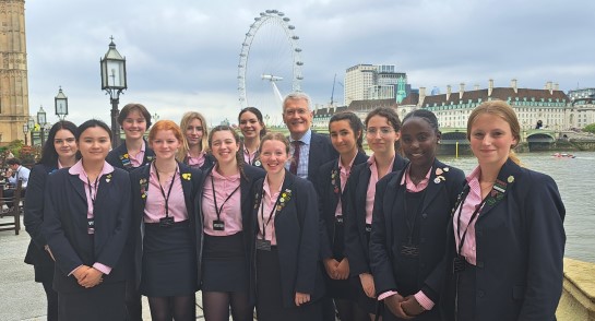 Harrogate Ladies' College Sixth Form Prefects stand with Harrogate and Knaresborough MP Andrew Jones on the House of Commons Terrace