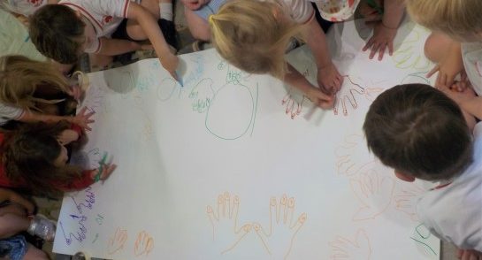 Transition pupils from Highfield Pre-School draw round their hands to create a collage as they develop their counting and numbers skills