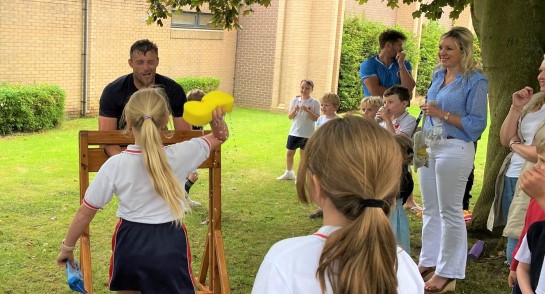 All the Fun of the Festival: Teachers get sponged in the face by Highfield Prep pupils at the annual HLC Summer Festival