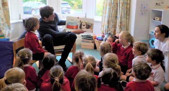 A Mystery Reader: Highfield Pre-School children enjoy a 'Mystery Reader' story by an enthusiastic parent who read the tale of 'The Runaway Pea'