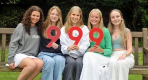 Pupils celebrating fantastic GCSE results pose with number 9's