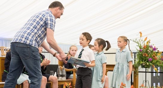 James McKay, Faculty of Engineering & Physical Sciences at University of Leeds, presents prizes to Highfield Prep School pupils at the annual Speech Day & Prizegiving. 