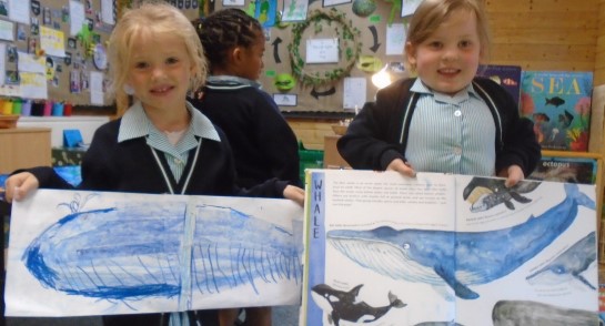 Having a Whale of a Time! Two Highfield Prep School Reception pupils showcasing their artwork based on the popular children's book The Snail and The Whale.