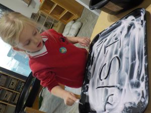 Transition pupils write names in strawberry conditioner
