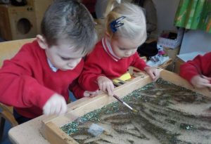 Pre-Schoolers making fireworks out of sparkles