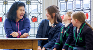 Principal (Acting), Mrs Joanna Fox smiling with pupils