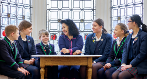 Principal (Acting), Mrs Joanna Fox smiling with pupils