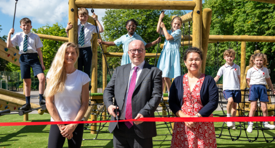 Highfield Prep School staff and pupils on the new playground.