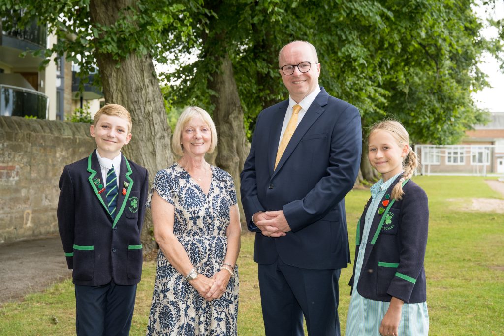 (L-R): Highfield Head Boy, Lorraine Simcock, James Savile, Highfield Head Girl.