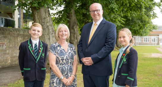 (L-R): Highfield Head Boy, Lorraine Simcock, James Savile, Highfield Head Girl.